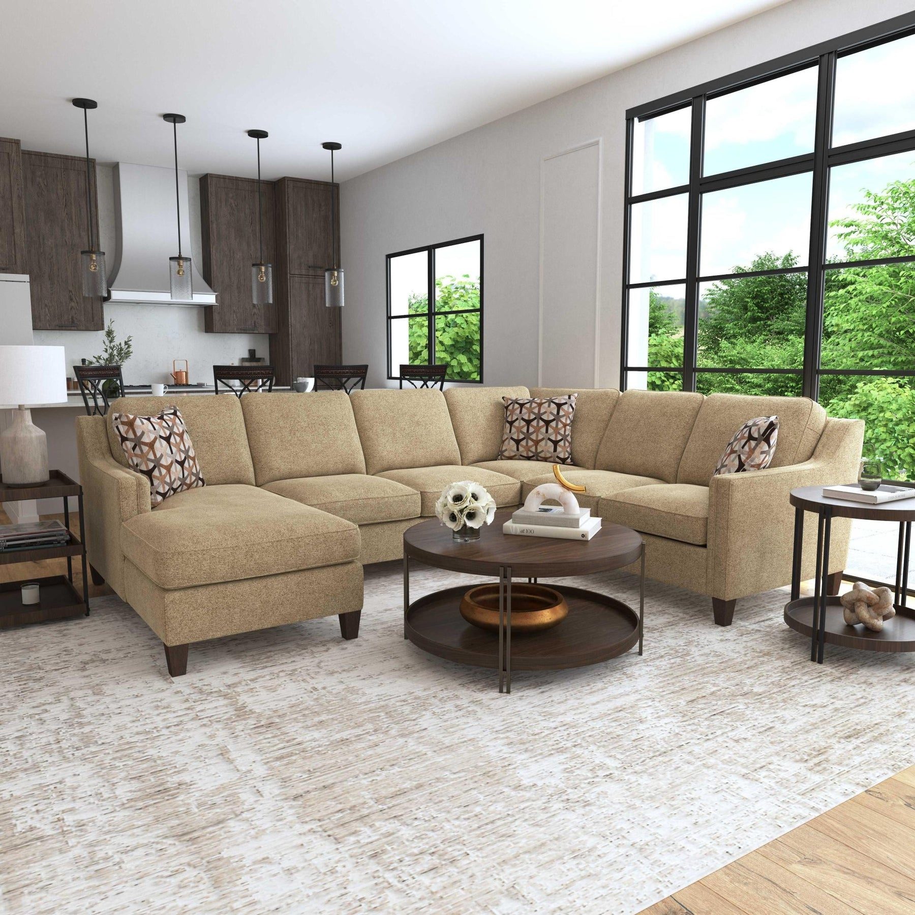 Tan sectional with a round coffee table
